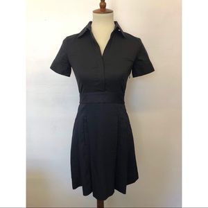 Theory shirt dress with pocket detail at skirt.
